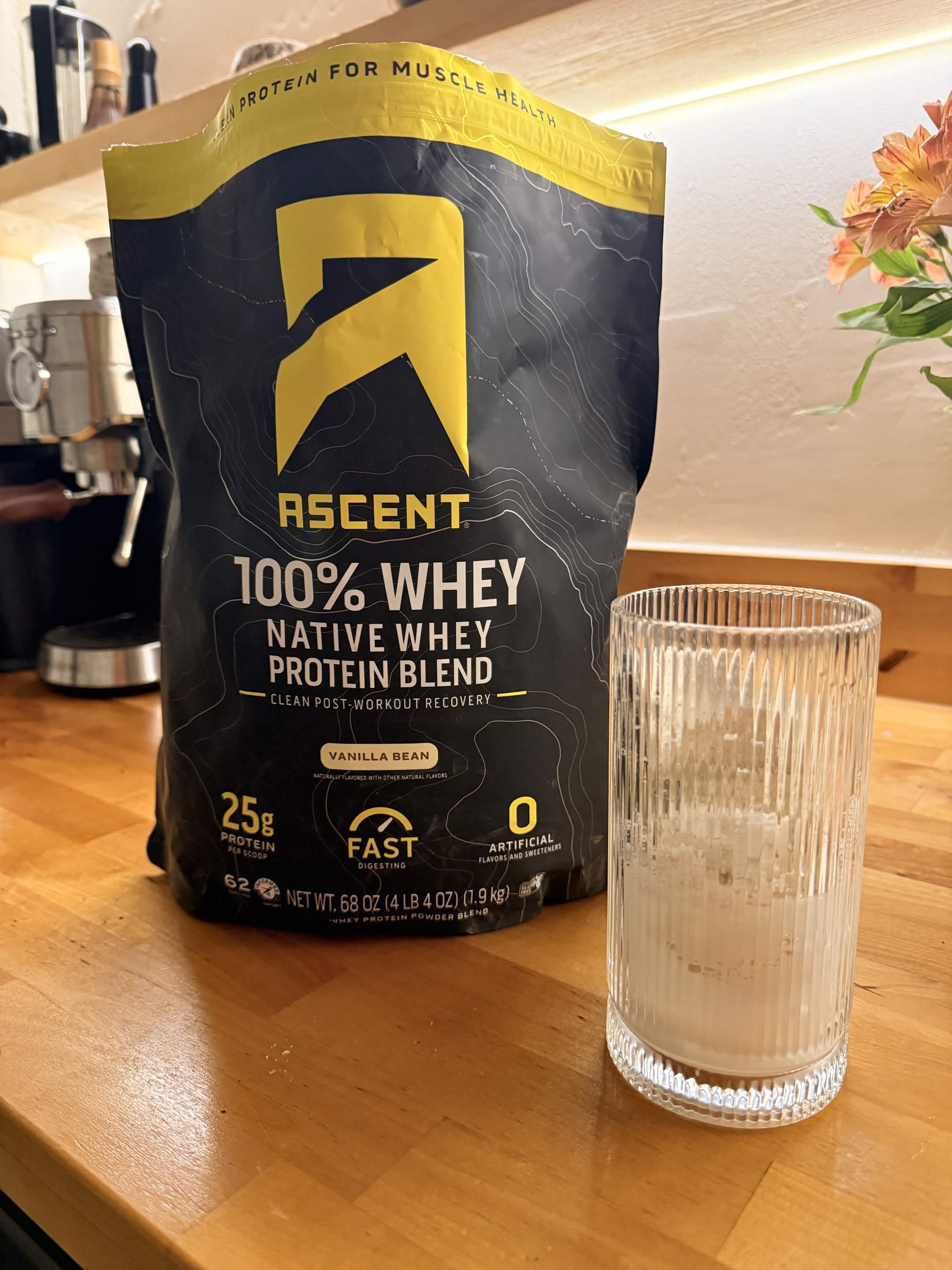 Ascent whey, vanilla bean, and an empty glass.