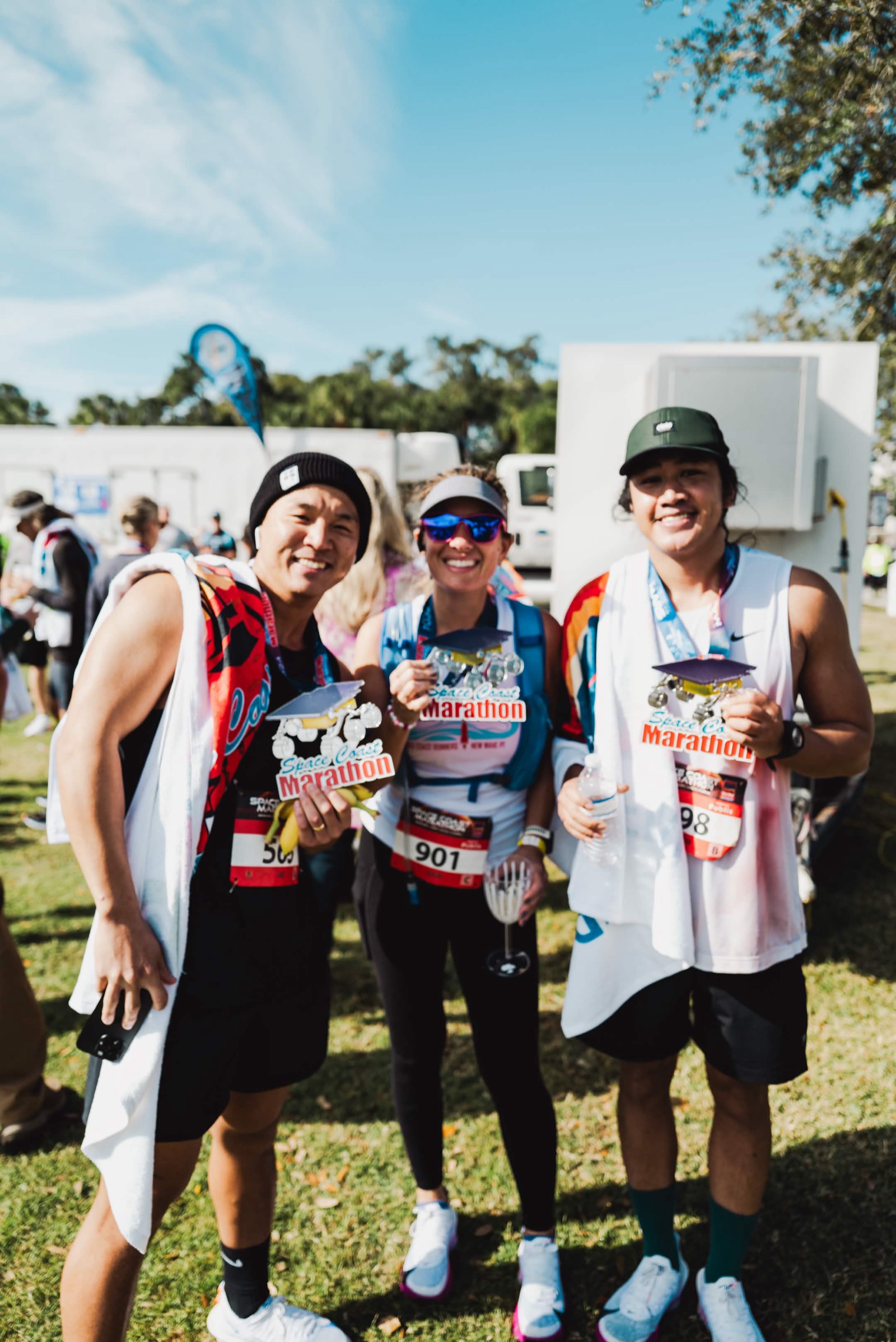 Post-race with medals — Jason on the right, a fellow runner in the middle.